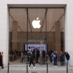 People walk past an Apple Store on March 25, 2024 in Berlin, Germany.