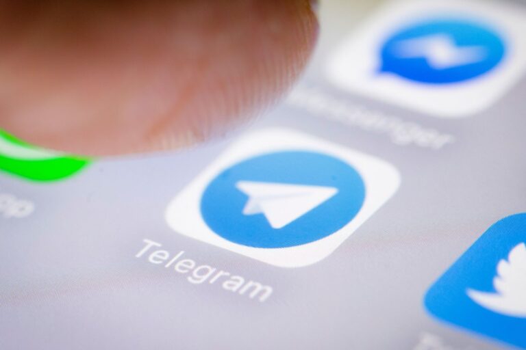 Photo illustration of the Telegram app icon on a smartphone