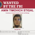 a screenshot of the FBI's wanted poster of AMIN STIGAL, a Russian man accused of conspiracy to hack Ukrainian government systems.