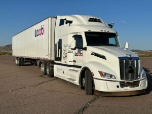 Image from front of white Peterbilt truck with Waabi logo and branding